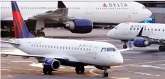  ?? CHARLES KRUPA/THE ASSOCIATED PRESS ?? Delta Air Lines Inc. lowered its fourth-quarter revenue forecast following disappoint­ing ticket pricing.