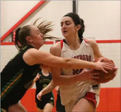  ?? JULIA MALAKIE — LOWELL SUN ?? Clinton’s Ava Lemanski, left, tries to stop Tyngsboro’s Gianna Donato from scoring Friday night. Donato and Tyngsboro rolled to a 59-21state tournament win.