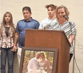  ?? USA TODAY NETWORK FILE PHOTO ?? Surrounded by members of her family, Kimberly Dotson, widow of Robert Dotson, talks about her husband’s shooting by Farmington police officers during an April 20 press conference in Farmington.