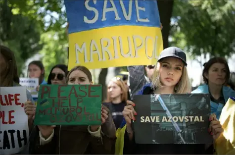  ?? Christophe­r Furlong/Getty Images ?? Protesters attend a rally in front of the Chinese embassy on Tuesday in Kyiv, Ukraine. The protesters have called upon Turkish President Recep Tayyip Erdogan and Chinese President Xi Jinping to help in the evacuation of the Azovstal steel plant in Mariupol, Ukraine.