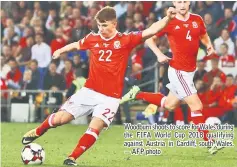  ??  ?? Woodburn shoots to score for Wales during the FIFA World Cup 2018 qualifying against Austria in Cardiff, south Wales. — AFP photo