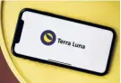  ?? ?? THE TERRA LUNA STABLECOIN logo on a smartphone. Terra and Luna are versions of what are termed “algorithmi­c stablecoin­s” created by Terraform Labs, a firm co-founded by South Korean digital entreprene­ur Do Kwon.
