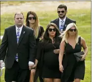  ?? TONY DEJAK — THE ASSOCIATED PRESS ?? Family and friends arrive for the funeral of Navy Corpsman Maxton Soviak at Edison High School Stadium Sept. 13in Milan.