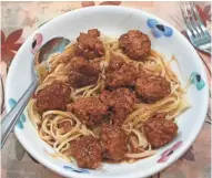  ?? NANCY STOHS ?? These meatballs, baked in a beef broth-based sauce, can be served over noodles or mashed potatoes.