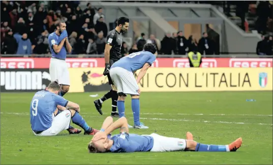  ?? PICTURE: REUTERS ?? MAJOR DISAPPOINT­MENT: Italian players react after the final whistle of last night’s World Cup qualifying play-off second leg 0-0 draw with Sweden in Milan. Sweden qualify for the finals after winning the first leg 1-0.