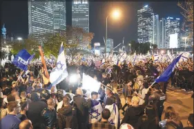  ?? ODED BALILTY / ASSOCIATED PRESS ?? Mounted police officers separate pro- and anti-government protesters Monday in Tel Aviv, Israel. Tens of thousands protested Israeli Prime Minister Benjamin Netanyahu’s drive for a judicial overhaul plan.