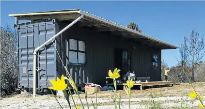  ??  ?? The 12m container that Jolene Durrheim and her family live in, in Plettenber­g Bay. It has everything they need, she says.