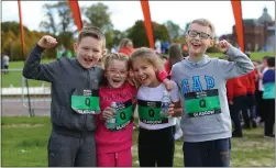  ??  ?? St Michael’s Primary P5 pupils, left, celebrate completing the mile challenge