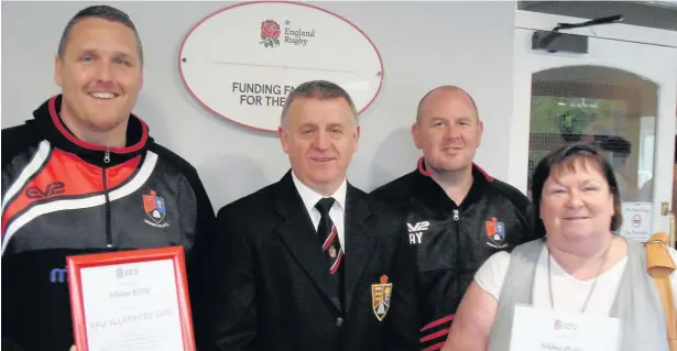  ??  ?? Widnes RUFC receive confirmati­on of the renewal of their Rugby Football Union Accreditat­ion. Pictured are junior coaches Mike Feeley and Allen York with club president Paul Newall and junior chairman Sharon Miller.