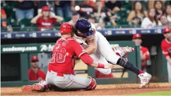  ?? AP ?? Jonathan Lucroy was let go by the Angels. Lucroy was injured in this collision with the Astros’ Jake Marisnick.