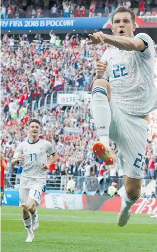  ??  ?? Artem Dzyuba celebrates his equaliser against Spain from the penalty spot.