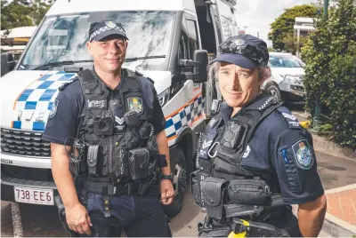  ?? Picture: Kevin Farmer ?? Senior Constable Neil Ault and Senior Constable Joanne Bailey outside the Mobile Police Beat parked at Clifford Gardens Shopping Centre on Tuesday.