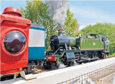  ??  ?? Large Prairie locomotive at North Weald level crossing on the Epping-ongar railway