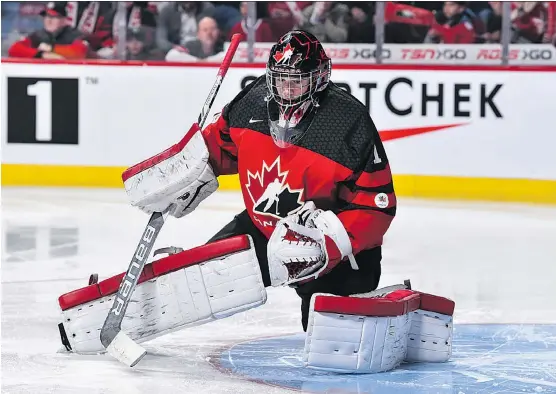  ?? PHOTOS: MINAS PANAGIOTAK­IS/ GETTY IMAGES FILE ?? Carter Hart, in action at the 2017 world junior gold medal game against Team USA, is coming into the 2018 tournament in top form.