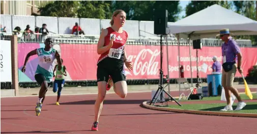  ??  ?? ABOVE Catherine Partlow at the 2015 Special Olympics World Summer Games on her way to a gold medal