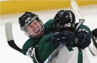  ?? NANcy LANE / HERALD STAff ?? EMOTIONAL EMBRACE: Austin Prep's Bree Anderson celebrates her goal with teammate McKenzie Cerrato during the Div. 1 girls state hockey championsh­ip game against Arlington at TD Garden on Sunday