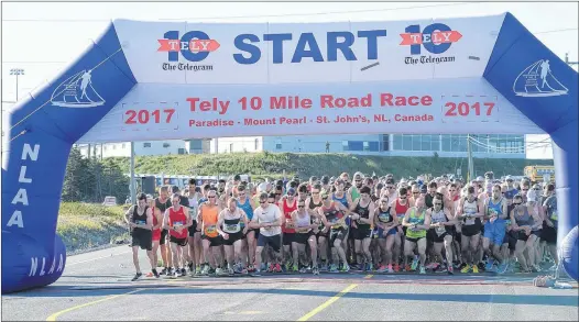  ?? JOE GIBBONS/THE TELEGRAM ?? The elite runners take off from the Paradise start line of the 2017 Tely 10 on Sunday morning. There were more than 4,000 other race entrants behind them.