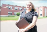  ?? JIM DAY/THE GUARDIAN ?? Dr. Heather Keizer, Prince Edward Island’s chief mental health and addictions officer, poses in front of Hillsborou­gh Hospital in Charlottet­own. The province is looking to replace the old building that opened in 1957.