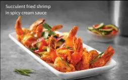  ??  ?? Succulent fried shrimp in spicy cream sauce