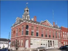  ?? PHOTO COURTESY MILFORD HISTORICAL SOCIETY ?? Milford Town Hall is the site of a controvers­ial, old fire horn, which sits atop the building. Its daily blaring was silenced last August.