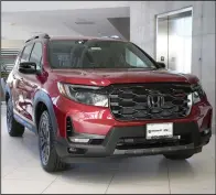  ?? (AP) ?? A 2024 Passport CR-V sport-utility vehicle is displayed at a Honda dealership in Highlands Ranch, Colo.