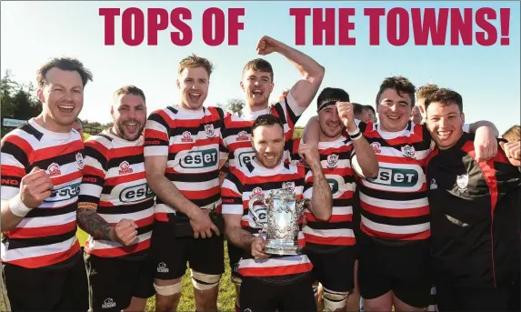  ??  ?? Enniscorth­y RFC players celebrate after winning the Bank of Ireland Provincial Towns Cup by beating Tullow RFC in the decider at Wicklow RFC. Report and photos inside.
