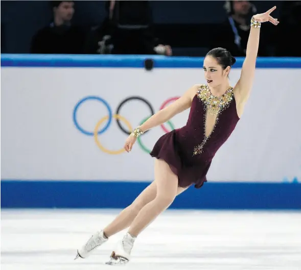  ?? DAMIEN MEYERDAMIE­N MEYER /AFP/GET TY IMAGES ?? Kaetlyn Osmond performs in the figure-skating free program last month at the Sochi Winter Olympics. She won a silver in the team event.
