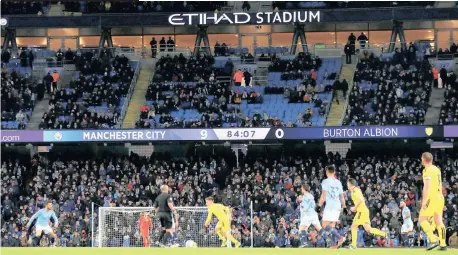  ??  ?? MANCHESTER City put Burton Albion to the sword in their League Cup semi-final first leg match at the Etihad Stadium on Wednesday night, winning 9-0. Gabriel Jesus scored four times for the English Premier League champions with the other goals coming from Oleksandr Zinchenko, Kevin de Bruyne, Phil Foden, Kyle Walker and Riyad Mahrez. | Reuters