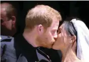  ?? AP/PTI ?? Britain's Prince Harry and Meghan Markle kiss after their wedding ceremony at St. George's Chapel in Windsor Castle in Windsor, near London, England, on Saturday