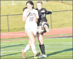  ?? RICK PECK/SPECIAL TO MCDONALD COUNTY PRESS ?? McDonald County’s Natalie Gillming clears the ball away from a Willard player during the Lady Mustangs’ 6-0 loss on April 1 at McDonald County High School.