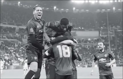  ?? Photo: VCG ?? Manchester United players celebrate after Alex Sandro’s own goal during the European Champions League match between Juventus and Manchester United at Allianz Stadium on Wednesday in Turin, Italy.