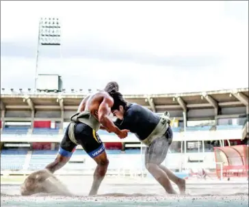  ?? JUAN BARRETO/AFP ?? A Venezuelan female sumo wrestler trains at the Brigido Iriarte stadium in Caracas in July.