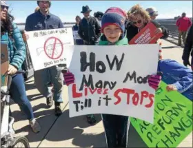  ?? PATRICIA DOXSEY — DAILY FREEMAN ?? Brayden Surprise, 12, of Highland displays one of the many signs in favor of gun control at Saturday’s March for Our Lives event at the Walkway Over the Hudson.
