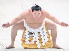  ?? — AFP ?? Hakuho performing a ring-entering ceremony at Meiji Shrine in Tokyo. file photo