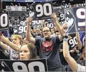  ?? JESSICA HILL / ASSOCIATED PRESS ?? Fans mark UConn’s 90-game win streak after Tuesday’s victory over USF in Hartford. The Huskies play SMU on Saturday in Dallas.