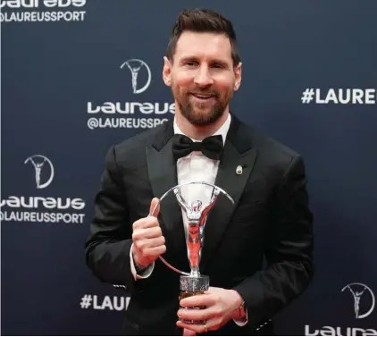  ?? ?? Argentine soccer player Lionel Messi poses after he was presented the award for sportspers­on of the year at the Laureus Sports Awards ceremony in Paris, Monday, May 8, 2023.
(AP Photo/Lewis Joly)