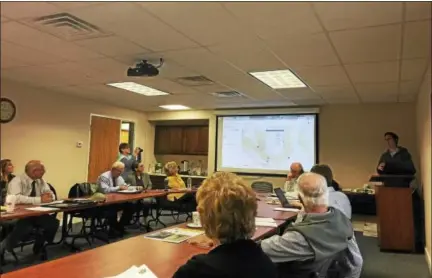  ?? PHOTOS BY BEN LAMBERT — THE REGISTER CITIZEN ?? Ryan Williams of the Housatonic Valley Associatio­n discusses a project to develop a comprehens­ive trail map with the Northwest Hills Council of Government­s Thursday in Goshen.