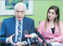  ?? JACQUES BOISSINOT/THE CANADIAN PRESS ?? Lawyer Guy Bertrand confirmed he served papers to TVA and political commentato­rs of La Joute over comments they made. His daughter Dominique Bertrand looks on.