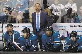  ?? Marcio Jose Sanchez / Associated Press ?? Head coach Peter DeBoer watches the scoreboard in the closing seconds of the Sharks’ season-ending 3-0 home loss to the Vegas Golden Knights on Sunday.