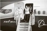  ?? Mike Siegel / Bloomberg ?? Steve Dickson, head of the Federal Aviation Administra­tion, exits a Boeing 737 Max airplane after a test flightWedn­esday in Seattle.