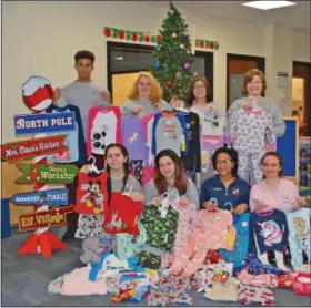  ?? SUBMITTED ?? Early Childhood Education juniors with their pajama collection for Genesis House. Back Row from left: Corey Middlebroo­ks (Oberlin), Teresa Clay (Brookside), Katerina Dehart (Wellington), Sydney Clark (Firelands)Front Row from left: Angelina Fracchione (Oberlin), Breana Caldwell (Clearview), Lindsey Oliver (Oberlin), Kaitlynn Starcher (Midview).