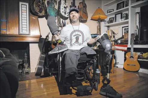  ?? Erik Verduzco Las Vegas Review-Journal @Erik_Verduzco ?? Scott Booth, a former pilot for Papillon Grand Canyon Helicopter­s, at his parents’ home in Long Beach, Calif., on Monday. Booth lost his legs as a result of a Feb. 10, 2018, crash in Arizona that killed five passengers.