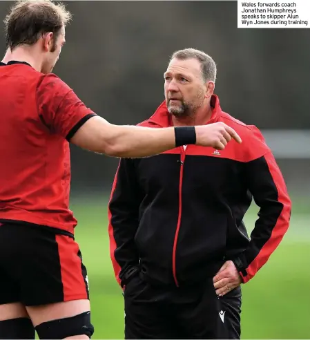 ??  ?? Wales forwards coach Jonathan Humphreys speaks to skipper Alun Wyn Jones during training