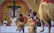  ?? (AP/Gregorio Borgia) ?? Pope Francis (second from left) looks at traditiona­l dancers performing Thursday at the Martyrs’ Stadium In Kinshasa, Democratic Republic of Congo.