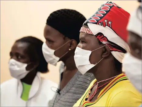  ?? Picture: REUTERS ?? MAKING PROGRESS: Patients with HIV and tuberculos­is (TB) wear masks while awaiting consultati­on at a clinic in Khayelitsh­a. Researcher­s have discovered that a simple urine test can speed up TB diagnosis in HIV patients, making it more effective than...