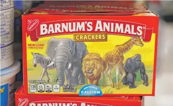  ?? CHARLIE NEIBERGALL/AP ?? North suburban-based Mondelez Internatio­nal has redesigned the packaging of its Barnum’s Animals crackers after a push from People for the Ethical Treatment of Animals.