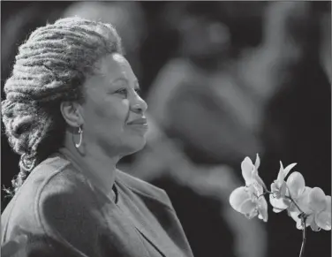  ?? AP Photo/Kathy Willens, File ?? File: In this April 5, 1994 file photo, Toni Morrison as she holds an orchid at the Cathedral of St. John the Divine in New York. The Nobel Prize-winning author has died. Publisher Alfred A. Knopf says Morrison died Monday, Aug. 5, 2019 at Montefiore Medical Center in New York. She was 88.