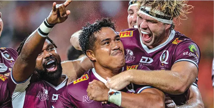  ?? Photo: rugby.com.au ?? Reds players Moses Sorovi (left) and Fraser McReight (right) celebrates with Alex Mafi (middle) after scoring his second try against Rebels at the Suncorp Stadium, Brisbane on February 27, 2021.