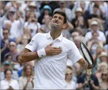  ?? KIRSTY WIGGLESWOR­TH — THE ASSOCIATED PRESS ?? Novak Djokovic celebrates Sunday after defeating Roger Federer in the men’s singles final in five sets at Wimbledon.