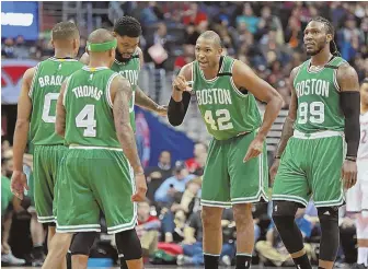  ?? STAFF PHOTO BY STUART CAHILL ?? TIME TO REGROUP: Celtics players huddle up during last night’s 92-91 loss to the Wizards, which forced a deciding Game 7 on Monday at the Garden.